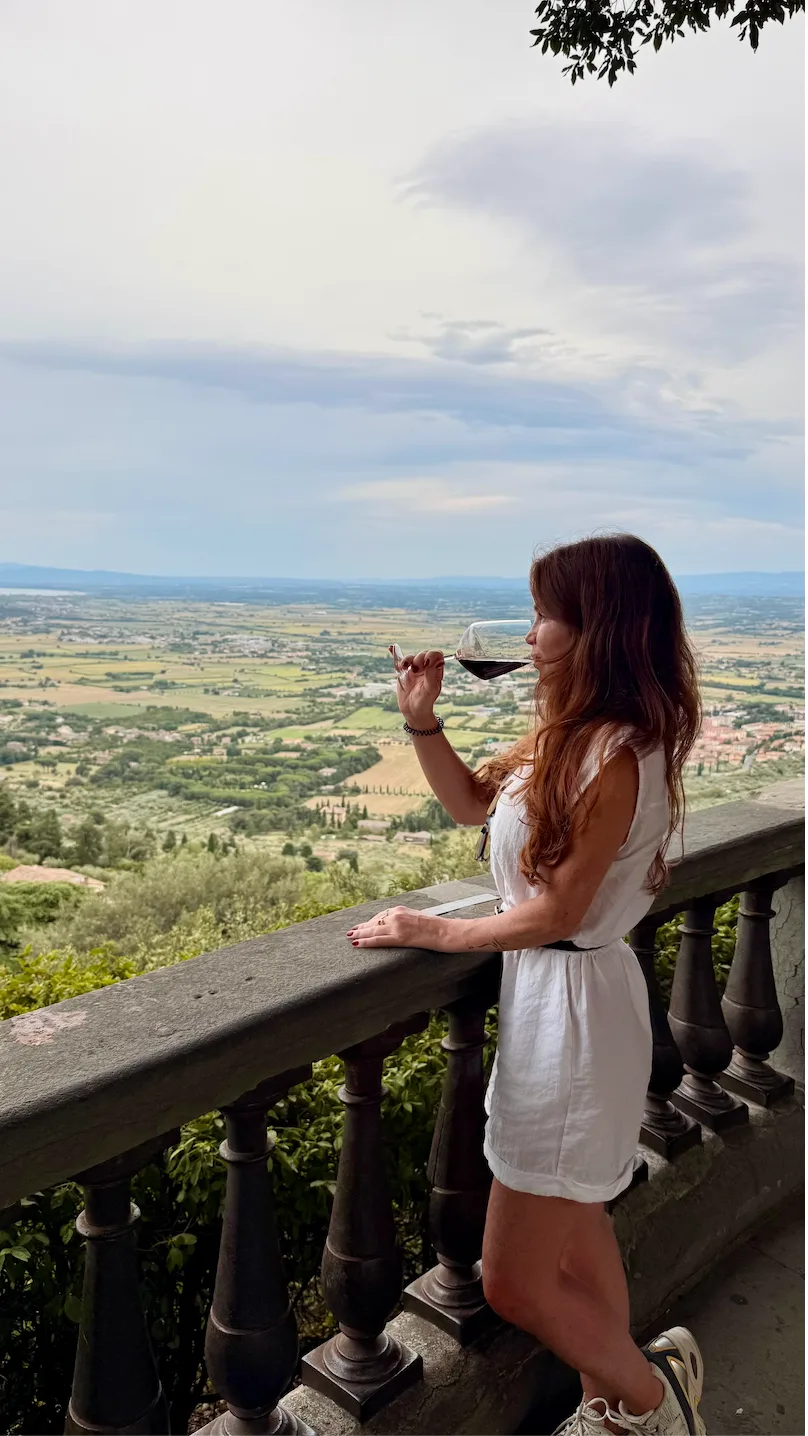 Natalie sipping wine in Cortona